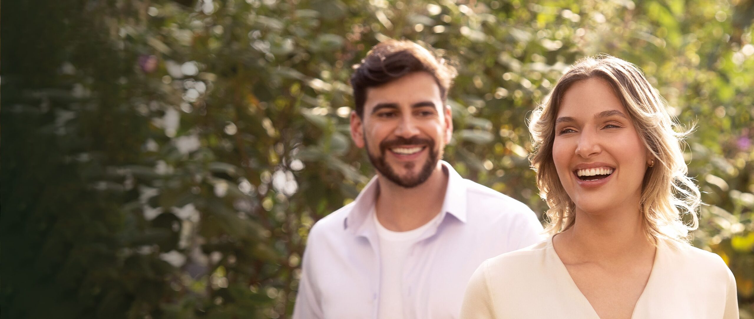 Smiling people surrounded by forest background